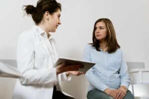 Woman getting checked out by doctor